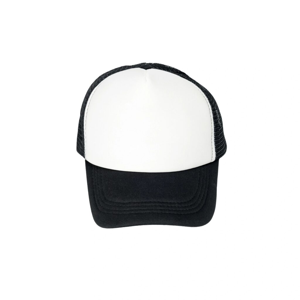 black and white mesh trucker cap facing forward placed straight in center on isolated white background